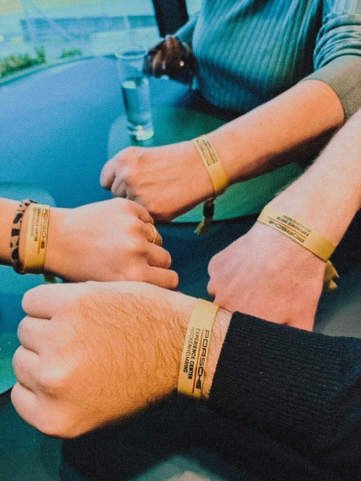 Crew wristbands from the Porsche Experience Centre.